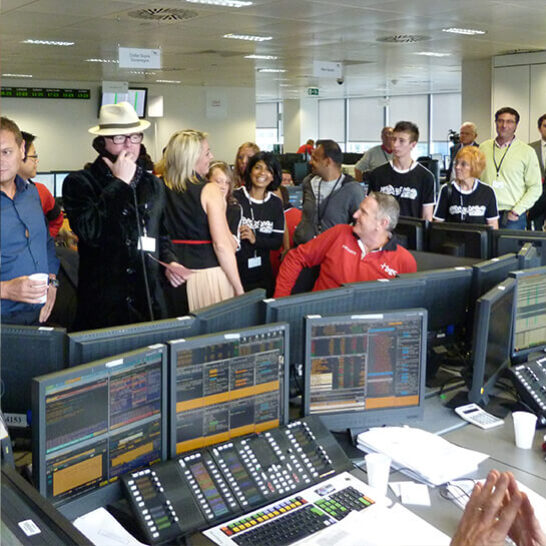 Man talking on the telephone at a Charity Event raising funds to find a cure for Glioblastoma (GBM)