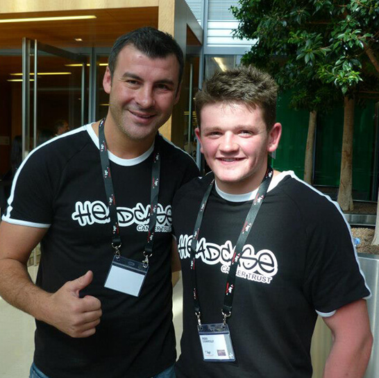 Men wearing charity t-shirts at a Charity Event raising funds to find a cure for Glioblastoma (GBM)